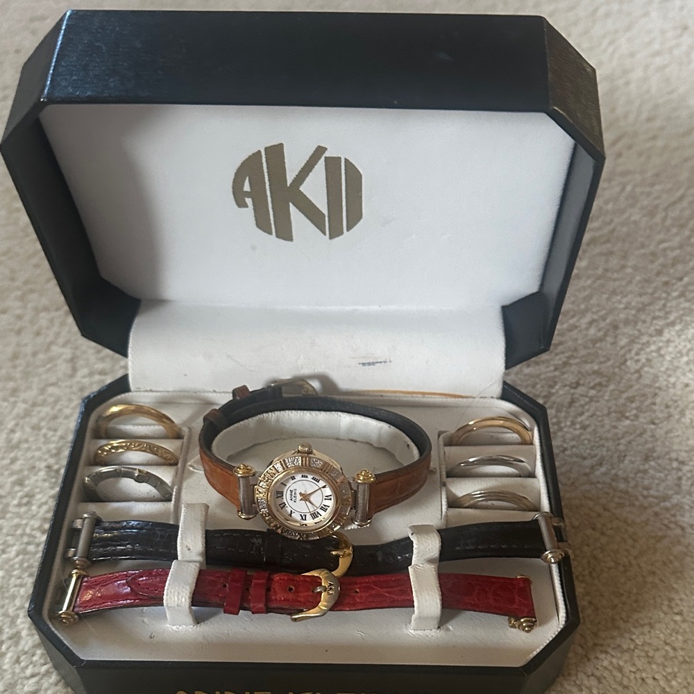 Anne Klein Gold-Tone Watch with Brown, Black and Red Straps